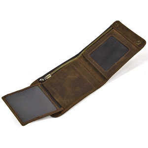 Macro detail of bifold leather wallet with zipper pocket and dual clear ID windows