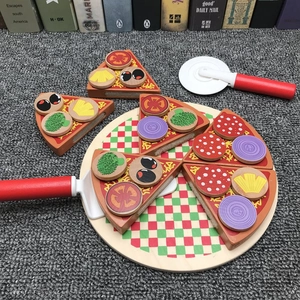 Detail of wooden play pizza set with velcro slices, serving tray and cutting tools