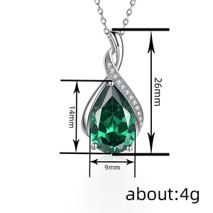 Elegant emerald teardrop pendant necklace in silver with sparkling side accent stones