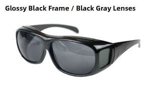 Detail of cycling sunglasses featuring a glossy black frame and black gray lenses
