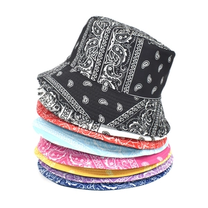 Stack of colorful paisley print cotton bucket hats for men and women in various vibrant colors