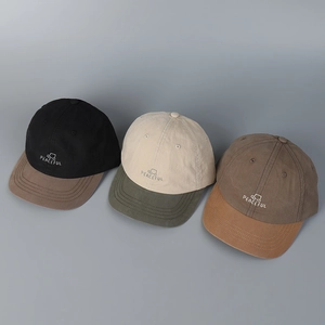 Detail of color-block baseball caps with Peaceful embroidery and car graphics