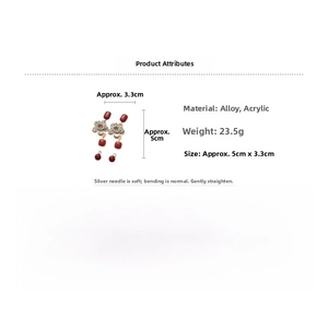 Detail showing vintage geometric earrings with red resin and silver needle studs