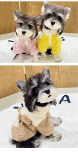 Detail of warm fleece dog jackets in pink yellow and brown with zip closure and D-ring