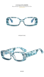 Detail view of model C15 rectangular glasses featuring blue floral frames and clear lenses
