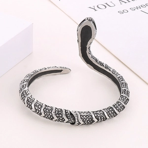 Vintage punk style stainless steel snake cuff bracelet with detailed scales on white background