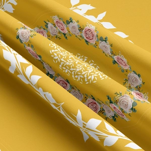 Detail of floral tapestry fabric with pink roses on yellow textured background