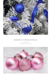 Blue and pink Christmas ball ornaments with matte and glitter finishes on tree