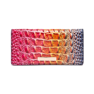 Detail view of colorful gradient alligator embossed long wallet with gold metal hardware