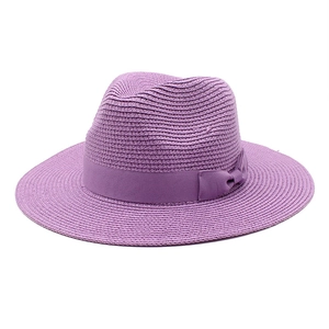 Classic purple woven straw sun hat with decorative ribbon bow for summer vacations