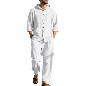 Detail of white linen hoodie shirt and matching drawstring trousers on male model
