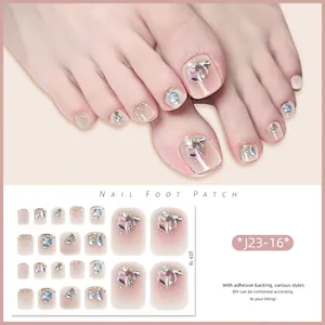 Macro shot of glittery nude pink gradient toe nail stickers with diamond crystal 3D accents