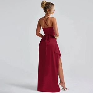 Detail of burgundy satin dress showing the backless lace-up design and high slit cut