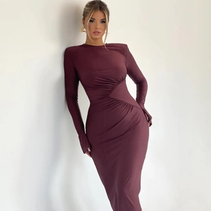 Detail of burgundy ruched waist dress featuring padded shoulders and slim fit design