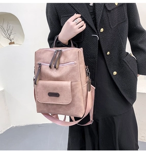 Detailed view of taupe pink PU leather backpack with multi-layer zippers and soft texture