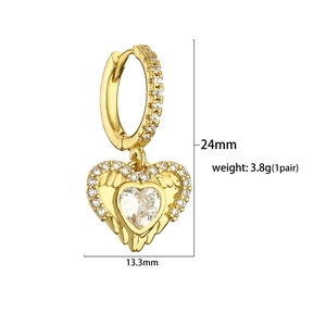 Detail view of 24mm gold heart hoop earrings with pink cubic zirconia and wing texture