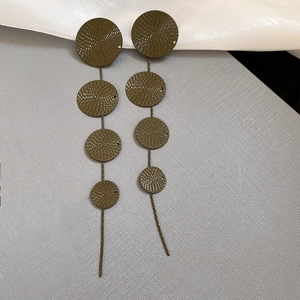 Long dark green floral metal drop earrings with textured circular links and tassel chain