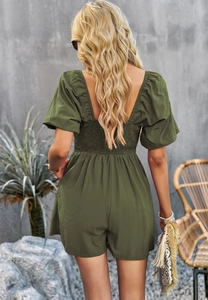 Detail of army green playsuit showing elastic smocked back and puff sleeves