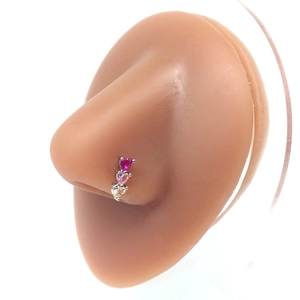 Three-heart surgical steel nose stud with red pink and yellow crystals on silicone model