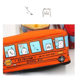 Detailed close-up of school bus pencil case with cartoon bear and fine stitching