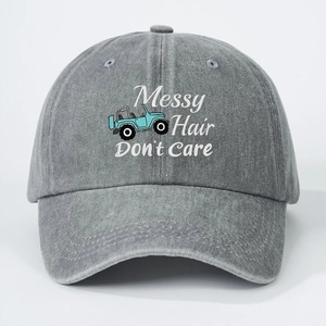 Faded grey washed cotton baseball cap with Messy Hair Don't Care text and jeep graphic