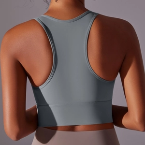 Close-up of charcoal grey racerback sports bra showing ergonomic back design and fit