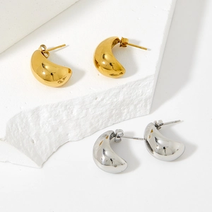 Polished stainless steel waterdrop earrings in gold and silver finish on stone