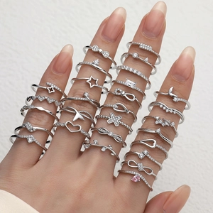 Set of minimalist S925 sterling silver rings with star heart and zircon on hand