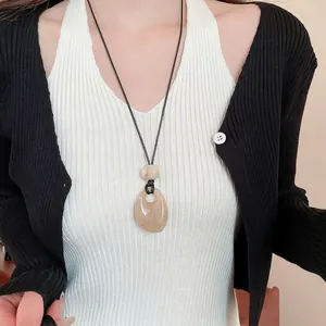 Vintage wax cord necklace with marble-textured teardrop pendant for elegant daily wear