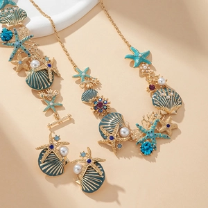 Parure de bijoux étoile de mer et coquillage dorée avec émail et perles pour la plage
