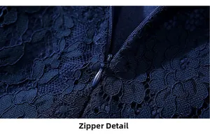Détail de la fermeture éclair invisible sur l'élégante robe en dentelle bleu marine