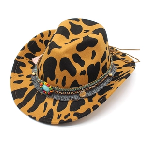 Detail of leopard print cowboy hat featuring turquoise beads and ethnic tassel band