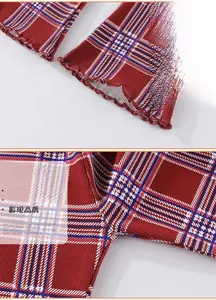 Detail of red plaid ribbed fabric with lettuce edge hem and fine inner stitching for girls