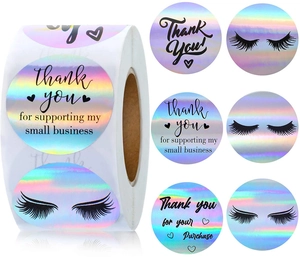 Detail of holographic laser thank you stickers with rainbow finish and eyelash design