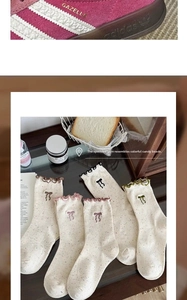 Detail of speckled yarn mid-calf socks with ruffled edges and bow embroidery
