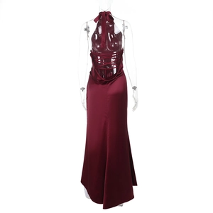 Detail of burgundy satin dress showing the backless halter design and lace-up straps