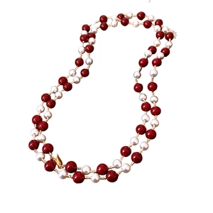 Vintage long necklace with red and pearl beads with gold accents for elegant winter outfits
