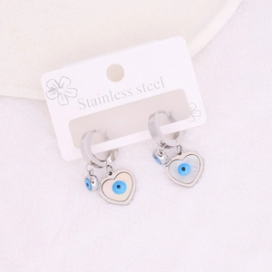 Long tassel stainless steel heart earrings with blue evil eye charms on a card