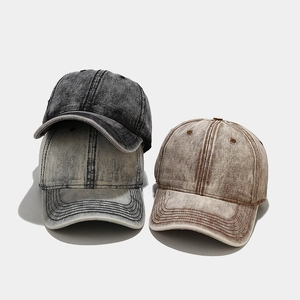 Vintage washed cotton baseball caps in charcoal black, rock grey, and caramel brown colors