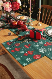 Christmas table runner with red ornaments and snowflakes on a dark green background