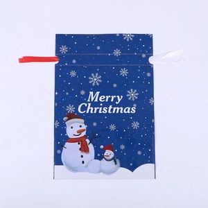 Detail of blue Christmas drawstring gift bag featuring snowman patterns and ribbons