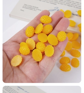 Macro shot of 1.5cm resin mango cubes with realistic texture for DIY miniature crafts