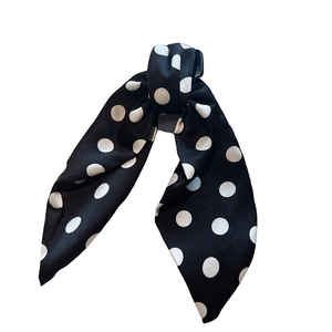 Elegant black fabric hair claw with white polka dots and a bow ribbon design