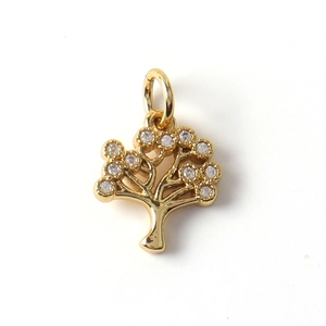 Detailed view of a gold-plated Tree of Life pendant with shimmering zircon inlays