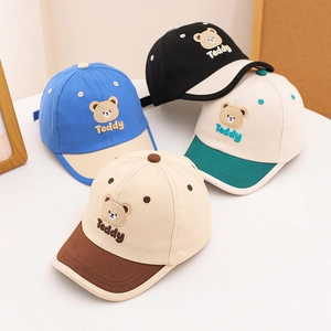 Kids cotton baseball caps featuring teddy bear embroidery and contrast brim design