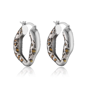 Close-up of silver irregular hoop earrings with fashionable leopard print patterns