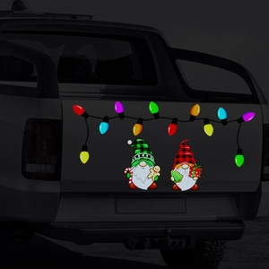 Magnetic reflective Christmas gnomes and colorful bulb decals on black pickup truck tailgate