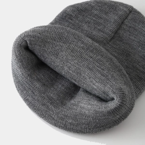 Detailed knit texture and inner lining of a dark grey unisex street hip-hop beanie
