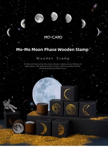 Macro view of moon phase wooden stamp with luxury black and gold celestial packaging