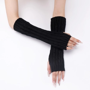 Detailed knit texture on long black fingerless gloves with elegant cable patterns